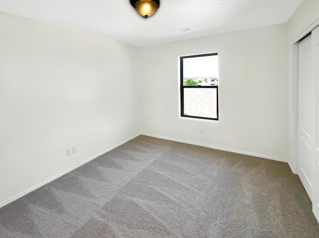 10909 Estribo St NW, Albuquerque, NM 87114 - unfurnished bedroom featuring carpet floors, baseboards, and a closet