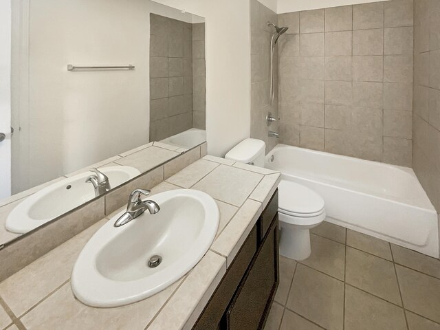 10909 Estribo St NW, Albuquerque, NM 87114 - full bath featuring toilet, vanity, tile patterned floors, and shower / bathtub combination