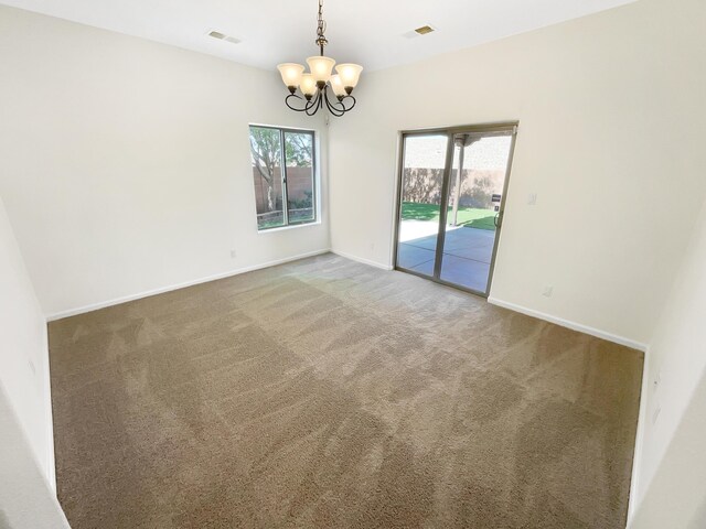 10909 Estribo St NW, Albuquerque, NM 87114 - carpeted spare room featuring a chandelier and baseboards