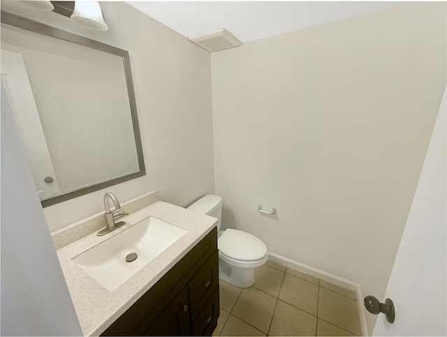 10909 Estribo St NW, Albuquerque, NM 87114 - half bathroom with toilet, vanity, and tile patterned flooring