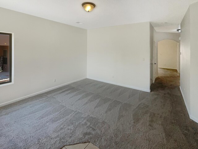 10909 Estribo St NW, Albuquerque, NM 87114 - carpeted spare room with arched walkways and baseboards
