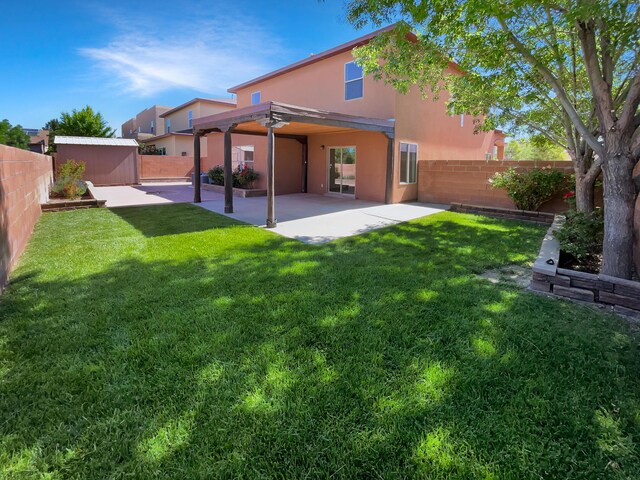 10909 Estribo St NW, Albuquerque, NM 87114 - rear view of house with a patio and stucco siding
