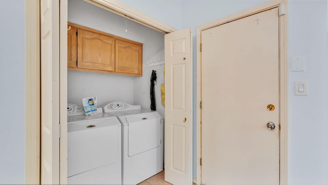 11041 Academy Ridge Rd NE, Albuquerque, NM 87111 - washroom featuring washing machine and clothes dryer, cabinet space, and light tile patterned floors