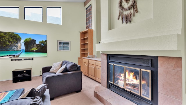 11041 Academy Ridge Rd NE, Albuquerque, NM 87111 - living area featuring a glass covered fireplace, light colored carpet, and a high ceiling