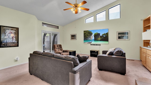 11041 Academy Ridge Rd NE, Albuquerque, NM 87111 - living room with light colored carpet, ceiling fan, baseboards, plenty of natural light, and high vaulted ceiling