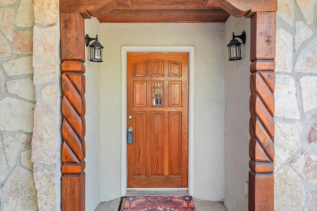 185 La Entrada Rd, Los Lunas, NM 87031 - doorway to property with stone siding