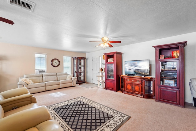 185 La Entrada Rd, Los Lunas, NM 87031 - living area featuring a ceiling fan, carpet, and a textured ceiling