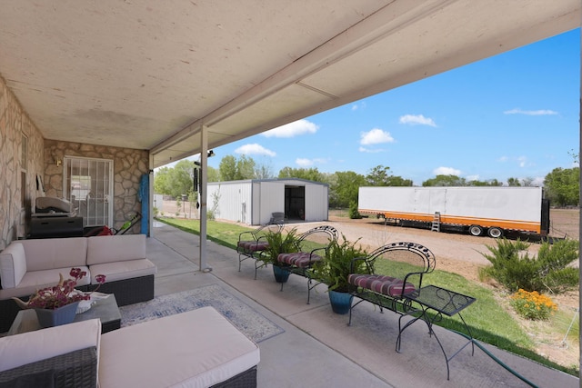 185 La Entrada Rd, Los Lunas, NM 87031 - view of patio / terrace with a grill, an outdoor hangout area, and an outdoor structure