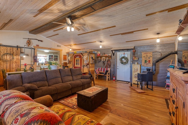 10 Berkshire Rd, Estancia, NM 87016 - living area with hardwood / wood-style floors, ceiling fan, a wood stove, and wooden ceiling