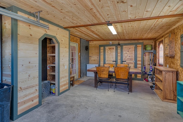 10 Berkshire Rd, Estancia, NM 87016 - dining room with wooden ceiling, wood walls, unfinished concrete floors, and arched walkways