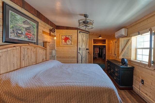 10 Berkshire Rd, Estancia, NM 87016 - bedroom with wood walls, an AC wall unit, wood finished floors, and a closet
