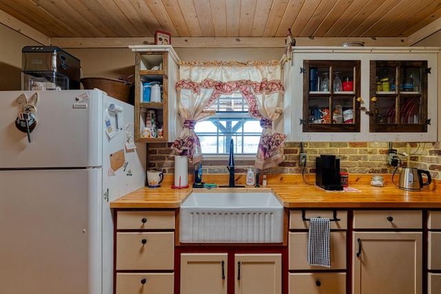 10 Berkshire Rd, Estancia, NM 87016 - kitchen with freestanding refrigerator, butcher block counters, and wood ceiling