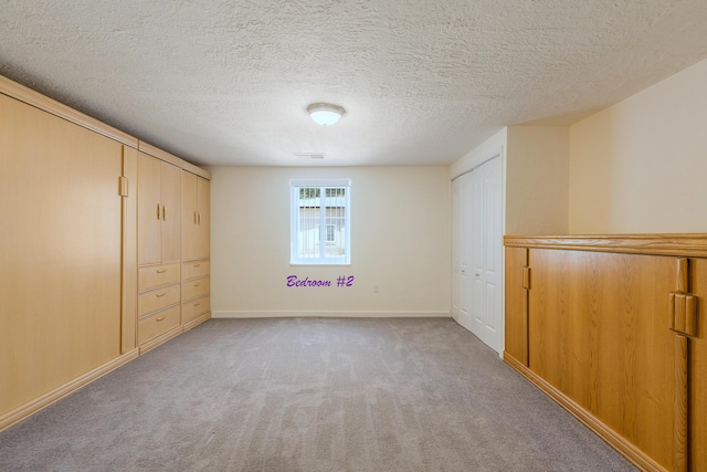 1201 Calle Placitas, Bernalillo, NM 87004 - unfurnished bedroom with light colored carpet and a textured ceiling