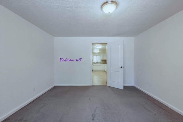 1201 Calle Placitas, Bernalillo, NM 87004 - carpeted empty room featuring baseboards and a textured ceiling