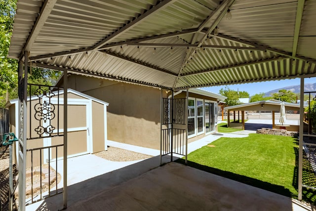 1201 Calle Placitas, Bernalillo, NM 87004 - view of patio / terrace featuring a shed and a mountain view