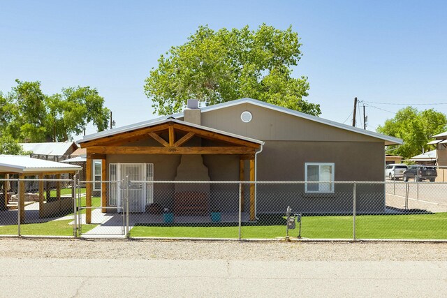 1201 Calle Placitas, Bernalillo, NM 87004 - view of front of home featuring stucco siding and a chimney