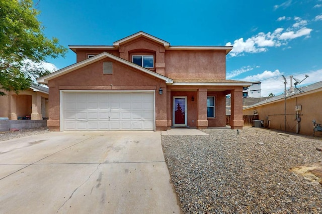 4001 Cresta Park Ave NW, Albuquerque, NM 87114 - view of front of house featuring stucco siding, driveway, and a garage