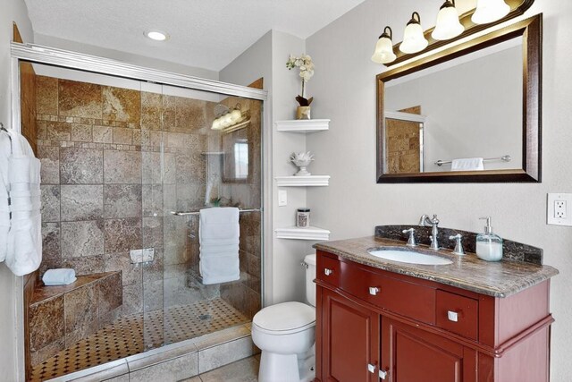 4001 Cresta Park Ave NW, Albuquerque, NM 87114 - full bathroom featuring vanity, a shower stall, and tile patterned flooring