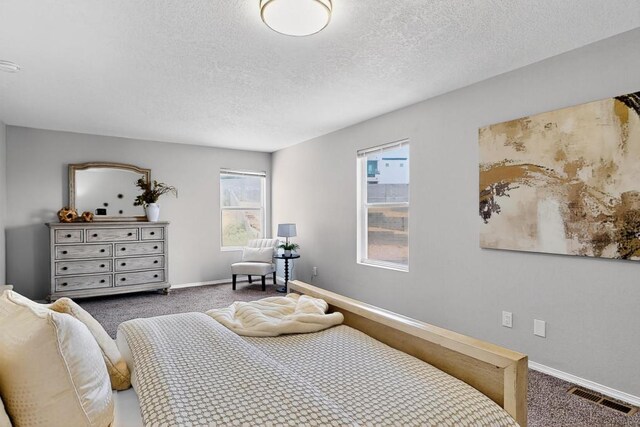4001 Cresta Park Ave NW, Albuquerque, NM 87114 - carpeted bedroom featuring a textured ceiling and baseboards