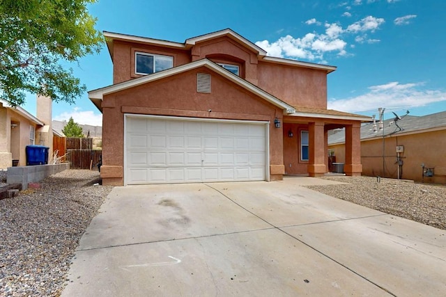 4001 Cresta Park Ave NW, Albuquerque, NM 87114 - view of front of property featuring driveway, stucco siding, and an attached garage