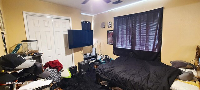 441 Colonial Ave SW, Los Lunas, NM 87031 - carpeted bedroom with a closet and ceiling fan