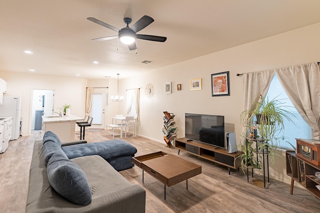 602 Camino Andres, Moriarty, NM 87035 - living room with light wood-style flooring, a ceiling fan, and recessed lighting