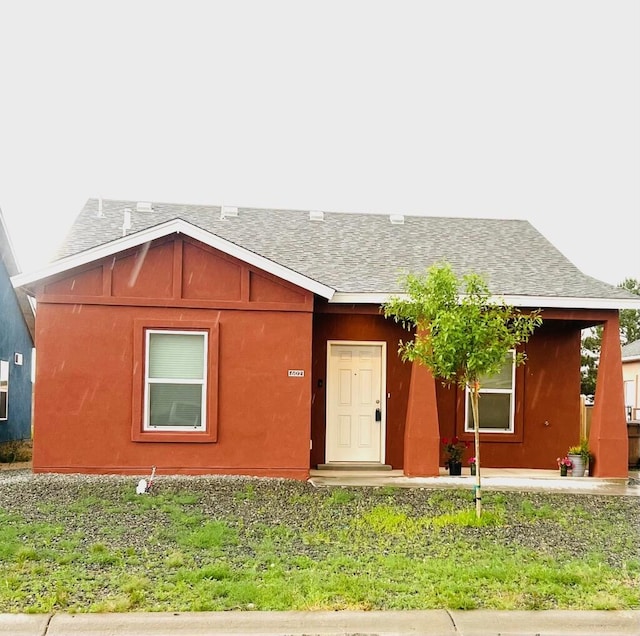 602 Camino Andres, Moriarty, NM 87035 - view of front facade with roof with shingles and stucco siding