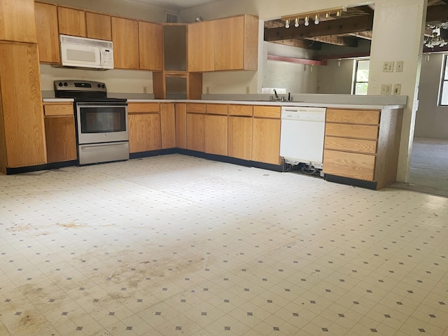 6011 Hubbell Cir SW, Albuquerque, NM 87105 - kitchen featuring white appliances, light countertops, and light floors