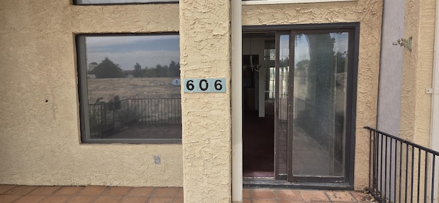 606 Eastlake Ct SE, Rio Rancho, NM 87124 - doorway to property with stucco siding