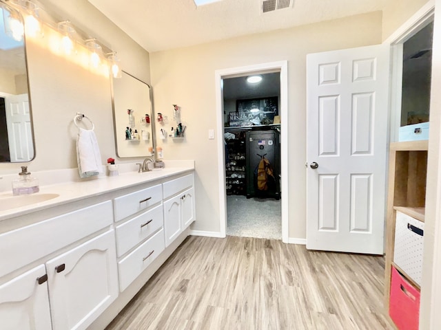 1704 Jack Nicklaus Dr, Rio Communities, NM 87002 - bathroom with wood finished floors and double vanity