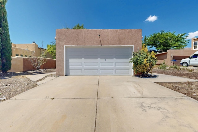 7939 Independence Dr NW, Albuquerque, NM 87120 - view of front of property with stucco siding and driveway