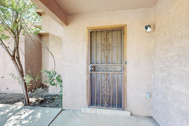 7939 Independence Dr NW, Albuquerque, NM 87120 - tiled living room with a wood ceiling with exposed beams, a ceiling fan, and a towering ceiling
