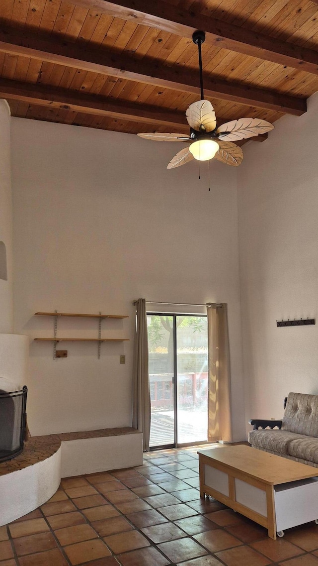 7939 Independence Dr NW, Albuquerque, NM 87120 - tiled living room featuring a wooden ceiling with exposed beams, ceiling fan, and a high ceiling
