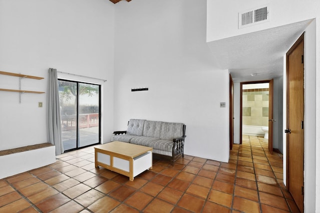 7939 Independence Dr NW, Albuquerque, NM 87120 - living area with a high ceiling and tile patterned floors
