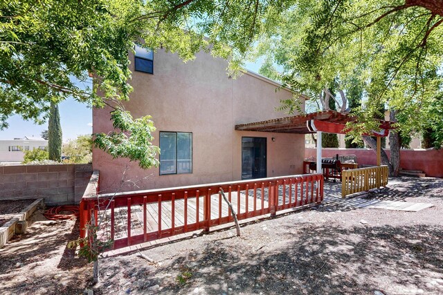 7939 Independence Dr NW, Albuquerque, NM 87120 - rear view of house featuring stucco siding and a fenced backyard