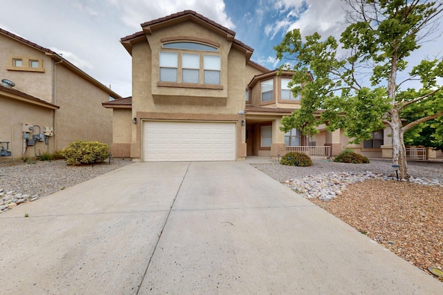 1468 Montiano Loop SE, Rio Rancho, NM 87124 - view of front of home featuring driveway, stucco siding, and an attached garage