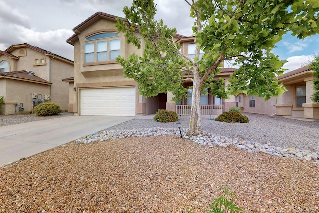 1468 Montiano Loop SE, Rio Rancho, NM 87124 - view of front of property featuring driveway, stucco siding, a garage, and covered porch