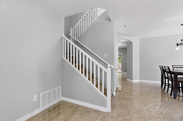 1468 Montiano Loop SE, Rio Rancho, NM 87124 - stairway featuring arched walkways and marble finish flooring
