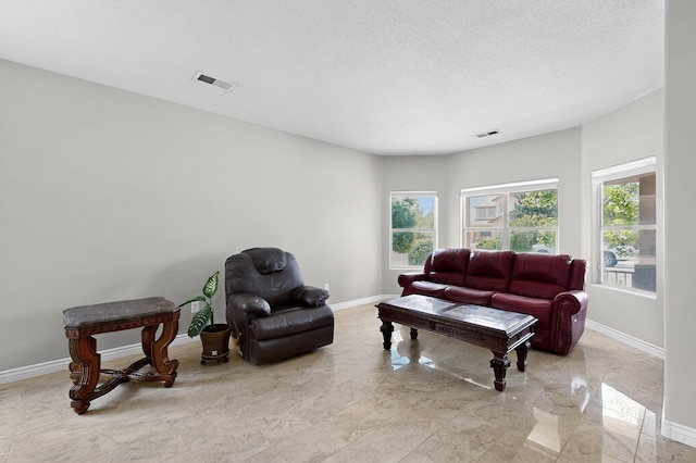1468 Montiano Loop SE, Rio Rancho, NM 87124 - living area featuring marble tiled flooring and baseboards