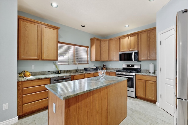1468 Montiano Loop SE, Rio Rancho, NM 87124 - kitchen featuring stainless steel appliances, a center island, light stone countertops, and recessed lighting