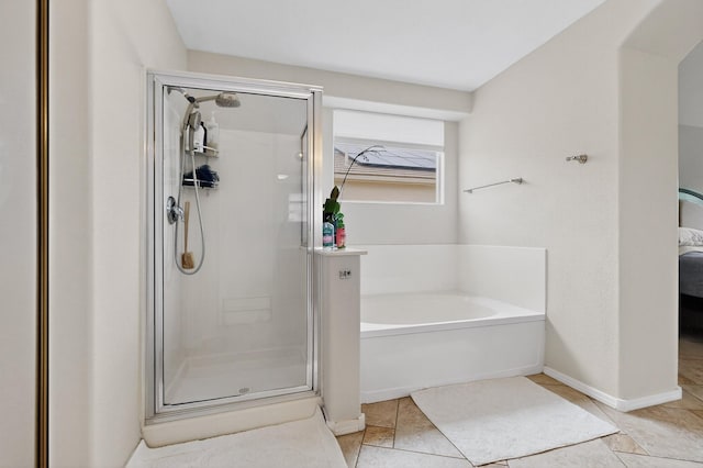 1468 Montiano Loop SE, Rio Rancho, NM 87124 - full bathroom featuring a stall shower, a bath, connected bathroom, and tile patterned flooring