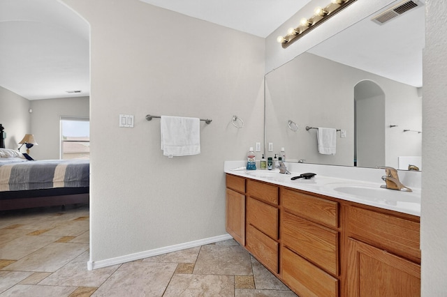 1468 Montiano Loop SE, Rio Rancho, NM 87124 - full bath featuring double vanity, ensuite bathroom, and stone finish flooring
