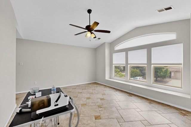 1468 Montiano Loop SE, Rio Rancho, NM 87124 - unfurnished room featuring ceiling fan, vaulted ceiling, and light stone finish flooring