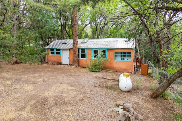 88 Tejano Canyon Rd, Sandia Park, NM 87047 - view of front facade featuring a metal roof and stucco siding