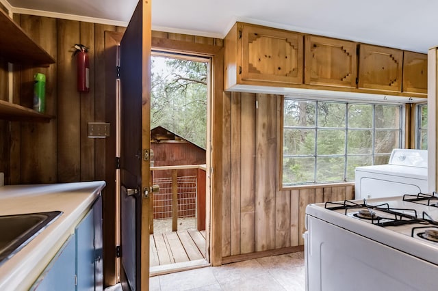 88 Tejano Canyon Rd, Sandia Park, NM 87047 - washroom with washer / dryer and wood walls