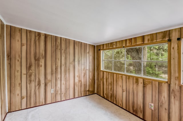 88 Tejano Canyon Rd, Sandia Park, NM 87047 - empty room with healthy amount of natural light, light flooring, and wooden walls