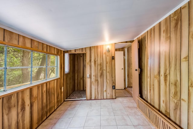 88 Tejano Canyon Rd, Sandia Park, NM 87047 - empty room with wooden walls and light tile patterned floors