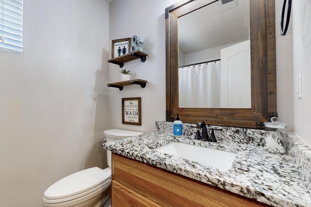 2704 Ghost Ranch St SW, Albuquerque, NM 87121 - bathroom with toilet and vanity