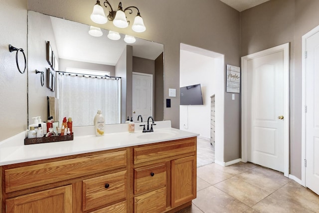2704 Ghost Ranch St SW, Albuquerque, NM 87121 - bathroom with vanity, tile patterned flooring, and a chandelier