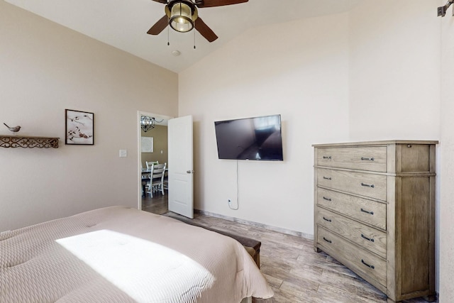 2704 Ghost Ranch St SW, Albuquerque, NM 87121 - bedroom with vaulted ceiling, light wood-style floors, and ceiling fan